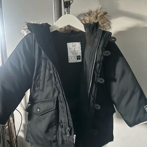 Black winter coat with fur-lined hood. Size 2.